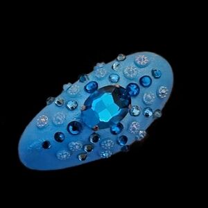 HAND-PAINTED BLUE ROCK WITH SWAROVSKY GEMS